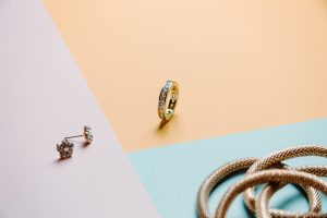 Colorful concept shot of jewelry with rings and earrings with three colors and minimal style